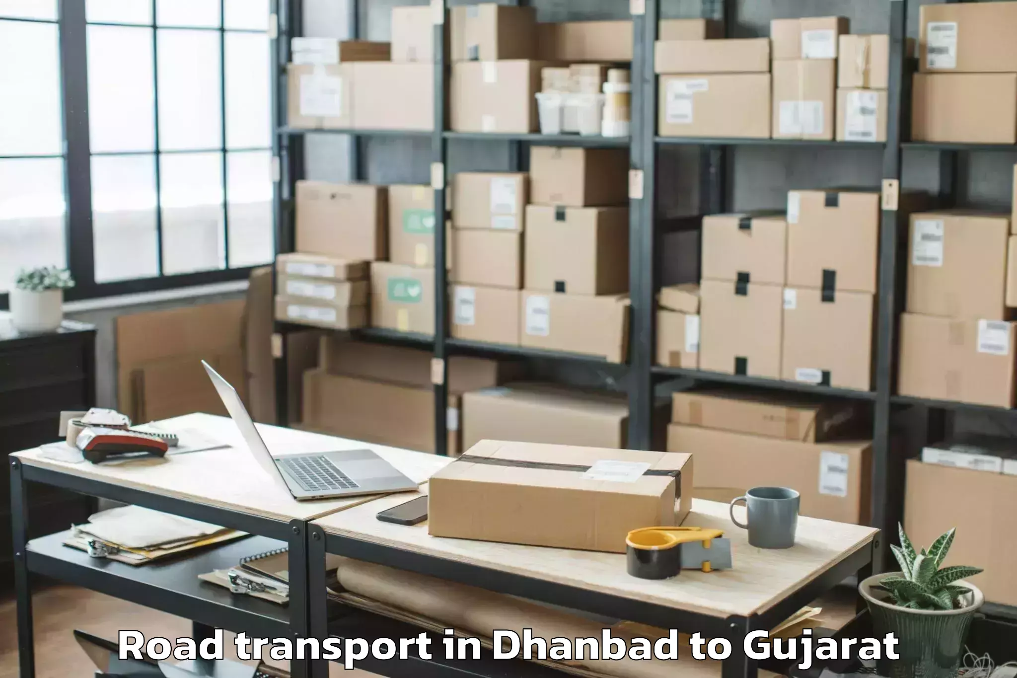 Easy Dhanbad to Una Gir Somnath Road Transport Booking